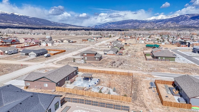 bird's eye view with a residential view and a mountain view