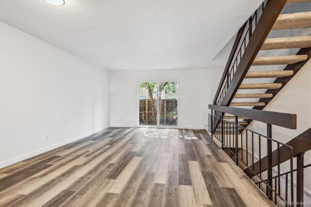 unfurnished living room with hardwood / wood-style floors