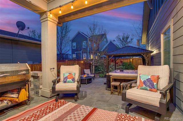8444 E 55th Pl, Denver, CO 80238 - view of patio / terrace featuring a gazebo, a fenced backyard, a hot tub, and a fire pit