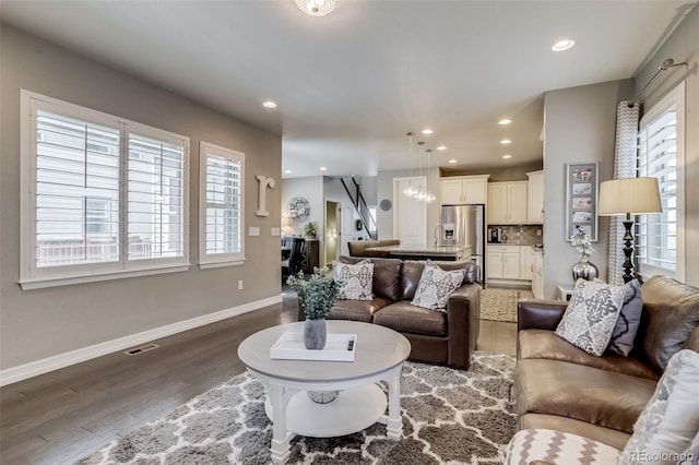 8444 E 55th Pl, Denver, CO 80238 - living room featuring baseboards, recessed lighting, wood finished floors, and visible vents