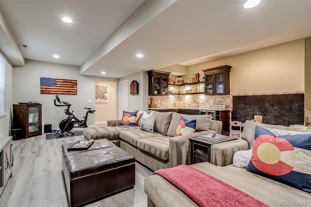 8444 E 55th Pl, Denver, CO 80238 - living room with light wood-style floors, recessed lighting, baseboards, and indoor bar