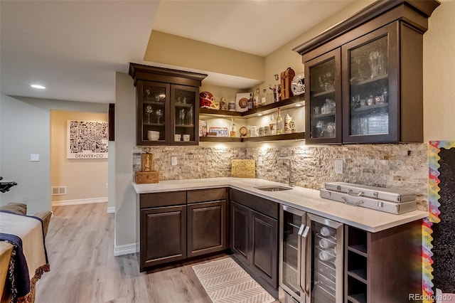 8444 E 55th Pl, Denver, CO 80238 - bar with backsplash, a sink, wine cooler, indoor bar, and light wood-style flooring