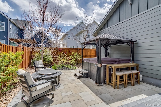 8444 E 55th Pl, Denver, CO 80238 - view of patio with a gazebo, a fenced backyard, and a hot tub