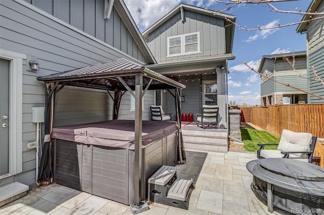 8444 E 55th Pl, Denver, CO 80238 - view of patio / terrace featuring a gazebo, a fenced backyard, and a hot tub