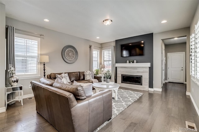 8444 E 55th Pl, Denver, CO 80238 - living area featuring wood finished floors, a fireplace, plenty of natural light, and recessed lighting
