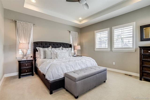 8444 E 55th Pl, Denver, CO 80238 - bedroom with light carpet, recessed lighting, a tray ceiling, and ceiling fan
