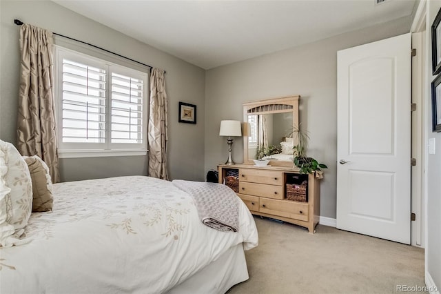 8444 E 55th Pl, Denver, CO 80238 - bedroom featuring light carpet and baseboards