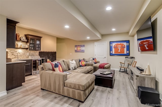 8444 E 55th Pl, Denver, CO 80238 - living room with beverage cooler, bar with sink, light wood-type flooring, and recessed lighting