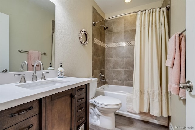 8444 E 55th Pl, Denver, CO 80238 - bathroom featuring vanity, shower / tub combo, wood finished floors, and a textured wall