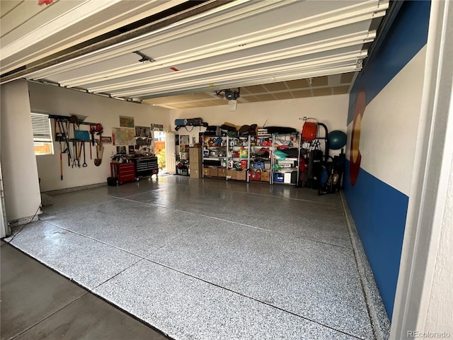 8444 E 55th Pl, Denver, CO 80238 - garage with a garage door opener and baseboards