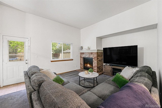 12261 N Holly Way, Brighton, CO 80602 - tiled living area with plenty of natural light and a fireplace