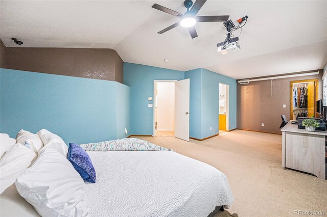 12261 N Holly Way, Brighton, CO 80602 - carpeted bedroom with vaulted ceiling, baseboards, and ceiling fan