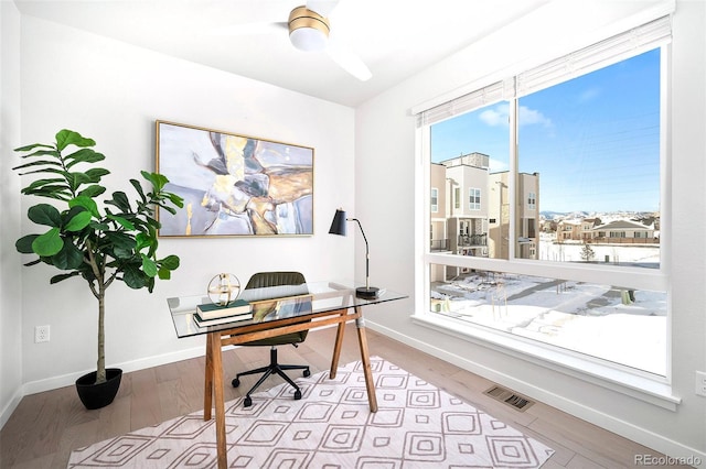 office area with light hardwood / wood-style flooring