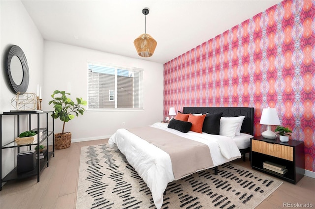 bedroom with light wood-type flooring