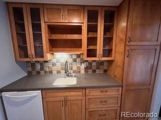 bar with white dishwasher, sink, and decorative backsplash