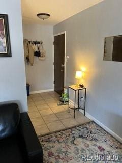 corridor with light tile patterned flooring