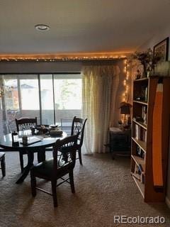 view of carpeted dining space