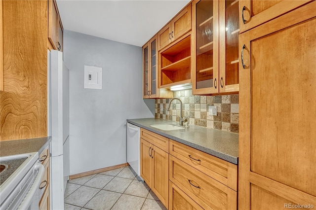 kitchen featuring light tile patterned floors, white appliances, a sink, tasteful backsplash, and brown cabinetry