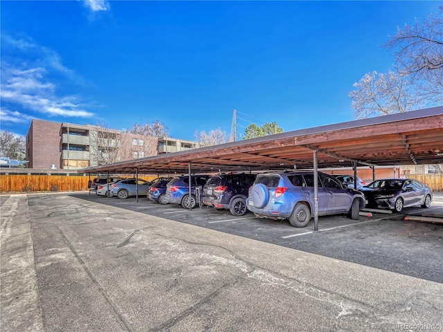 covered parking lot with fence