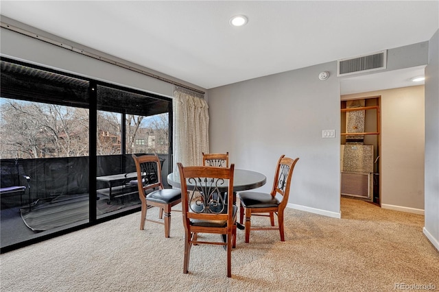 carpeted dining area with baseboards, visible vents, and recessed lighting