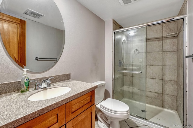 full bathroom with toilet, a stall shower, vanity, and visible vents