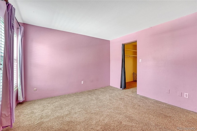 unfurnished room with carpet floors