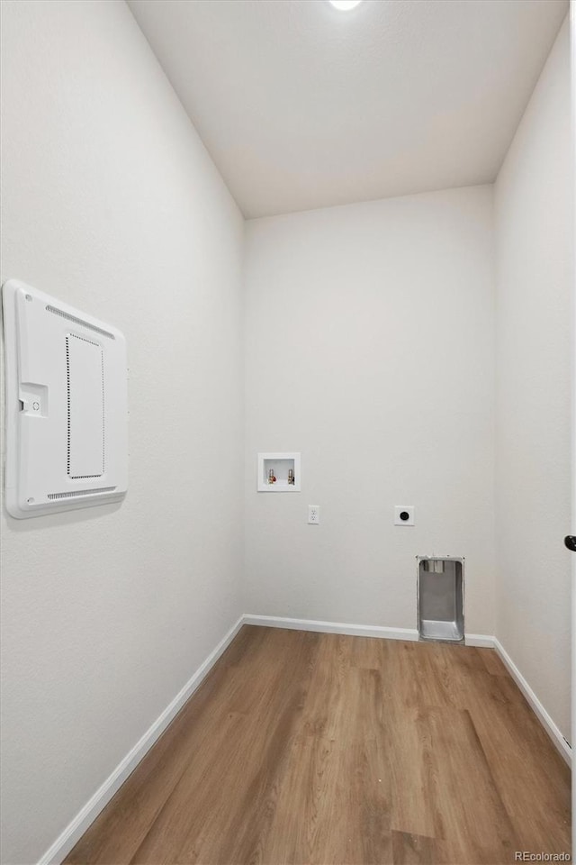 clothes washing area with hookup for a washing machine, wood-type flooring, and hookup for an electric dryer