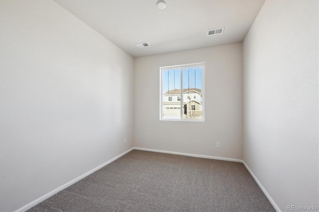 empty room featuring carpet flooring