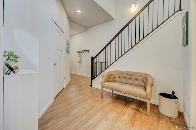 foyer with light hardwood / wood-style floors and washer / dryer