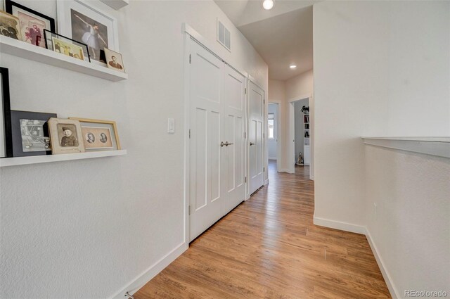 hall featuring light wood-type flooring