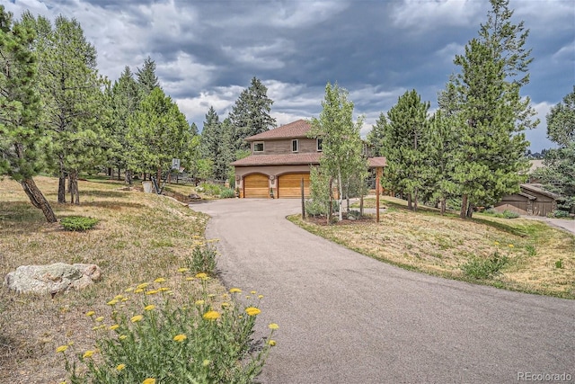 1361 Bross Ct, Evergreen, CO 80439 - view of front of property with an attached garage and asphalt driveway