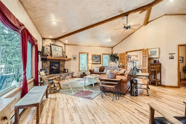 1361 Bross Ct, Evergreen, CO 80439 - living area featuring wood finished floors, healthy amount of natural light, beam ceiling, a ceiling fan, and recessed lighting