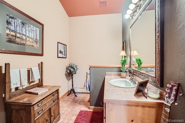 1361 Bross Ct, Evergreen, CO 80439 - bathroom featuring tile patterned flooring and vanity