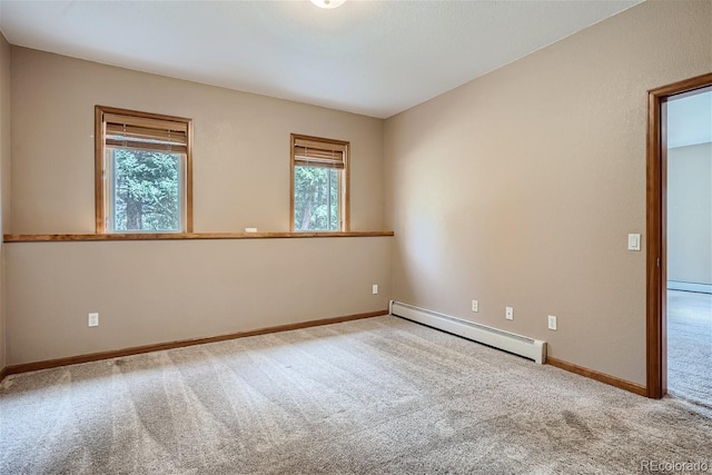 1361 Bross Ct, Evergreen, CO 80439 - carpeted empty room featuring baseboard heating and plenty of natural light