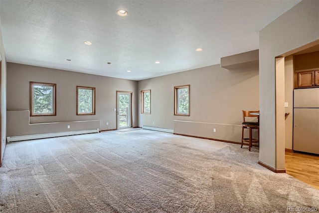 1361 Bross Ct, Evergreen, CO 80439 - spare room with baseboard heating, light carpet, and recessed lighting
