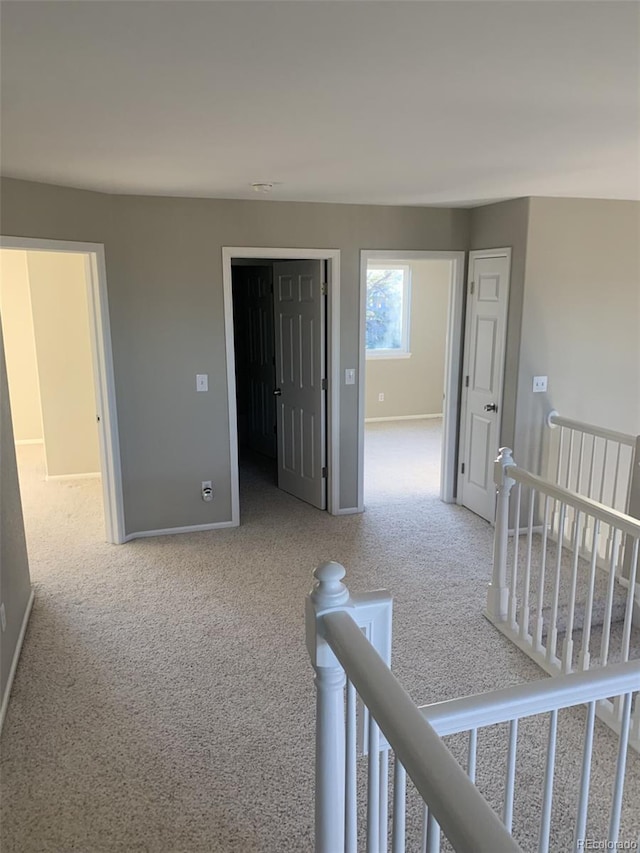 interior space with light carpet and a closet