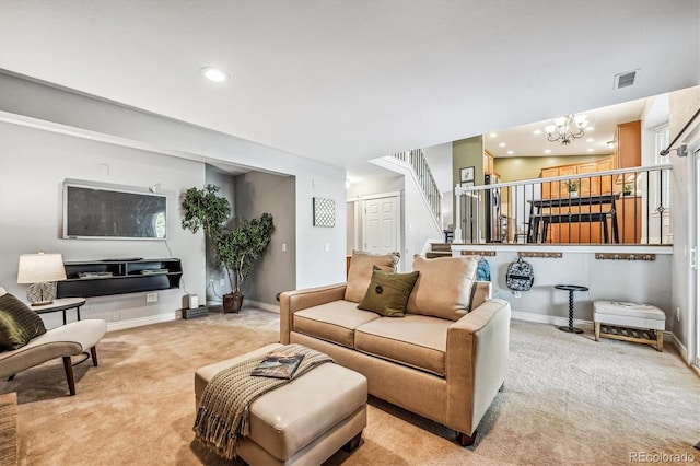 carpeted living area with a notable chandelier, recessed lighting, visible vents, stairway, and baseboards