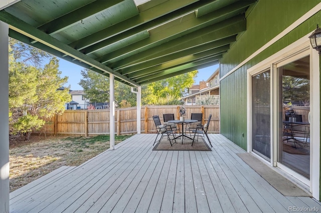 wooden terrace featuring fence and outdoor dining area