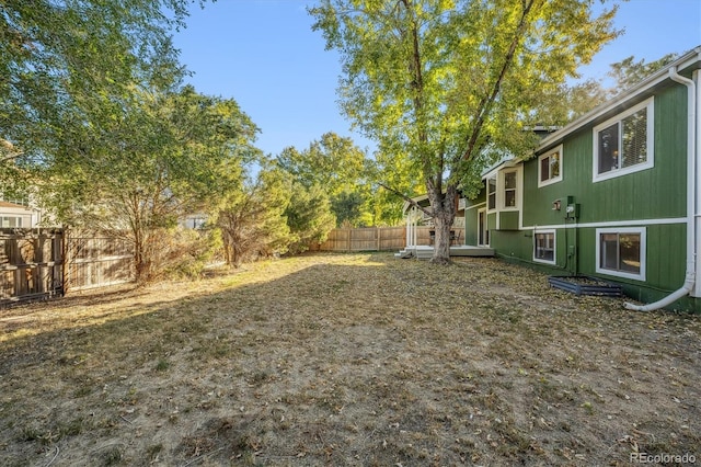 view of yard with a fenced backyard