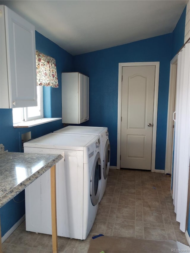 5511 Ridgetop Ct, Alamosa, CO 81101 - washroom with cabinet space and separate washer and dryer