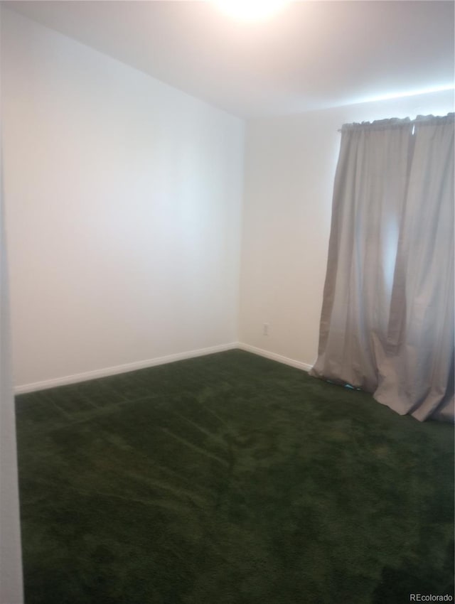 5511 Ridgetop Ct, Alamosa, CO 81101 - spare room with dark carpet and baseboards