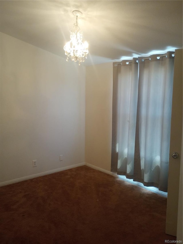 5511 Ridgetop Ct, Alamosa, CO 81101 - empty room with a chandelier and carpet floors