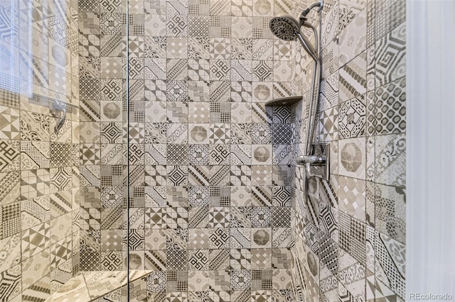 interior details with a tile shower