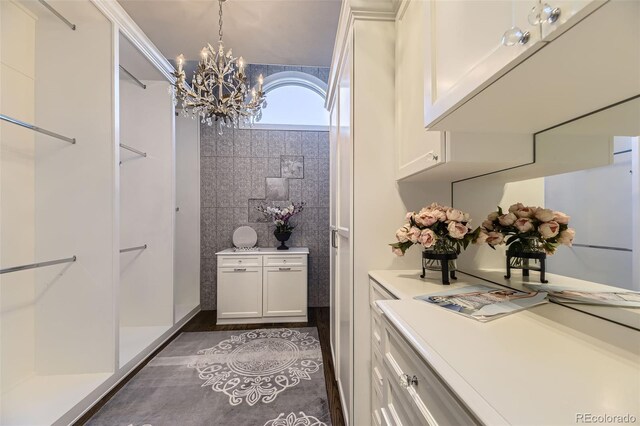 bathroom featuring an inviting chandelier