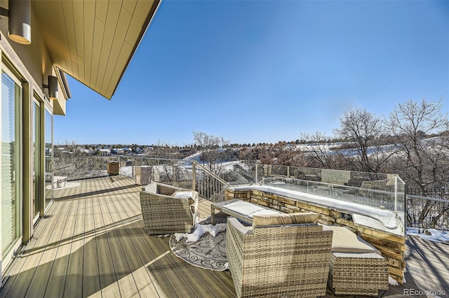 view of snow covered deck