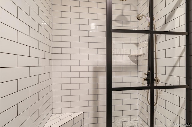 bathroom with a tile shower