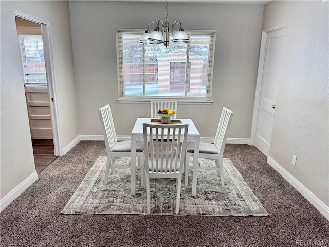 unfurnished dining area with carpet floors, a healthy amount of sunlight, and a notable chandelier