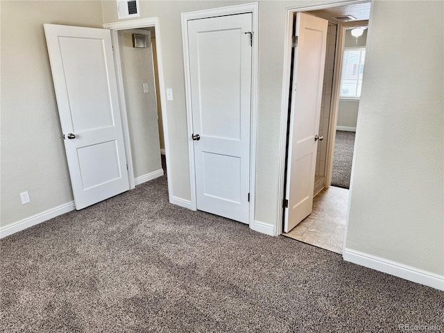 unfurnished bedroom featuring light colored carpet