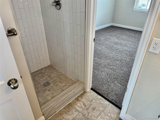 bathroom featuring a tile shower