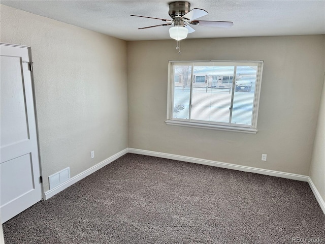 empty room with carpet floors and ceiling fan